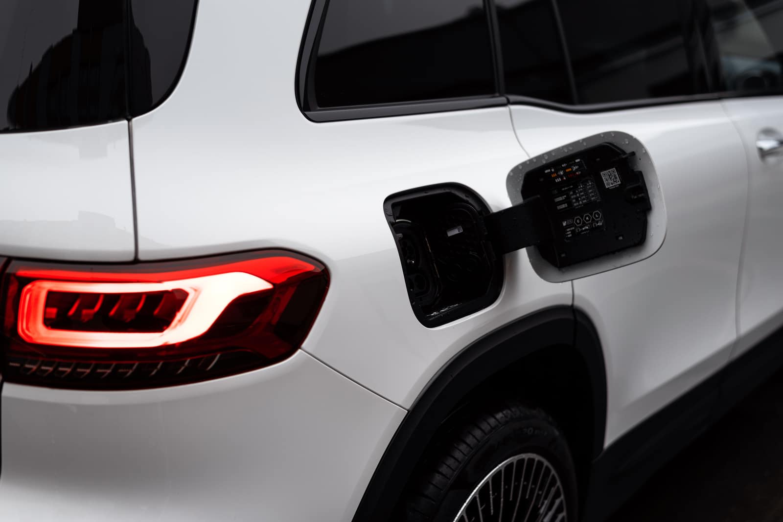 Close-up of an electric vehicle with its charging port door open