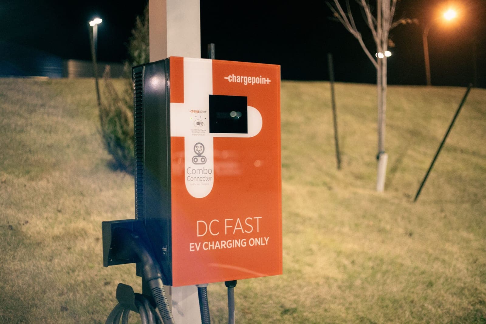 A DC fast charging station in a parking area