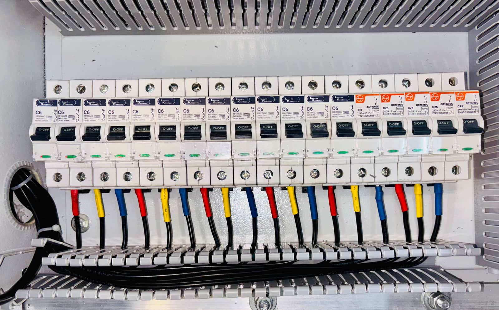 A residential electrical panel with circuit breaker switches