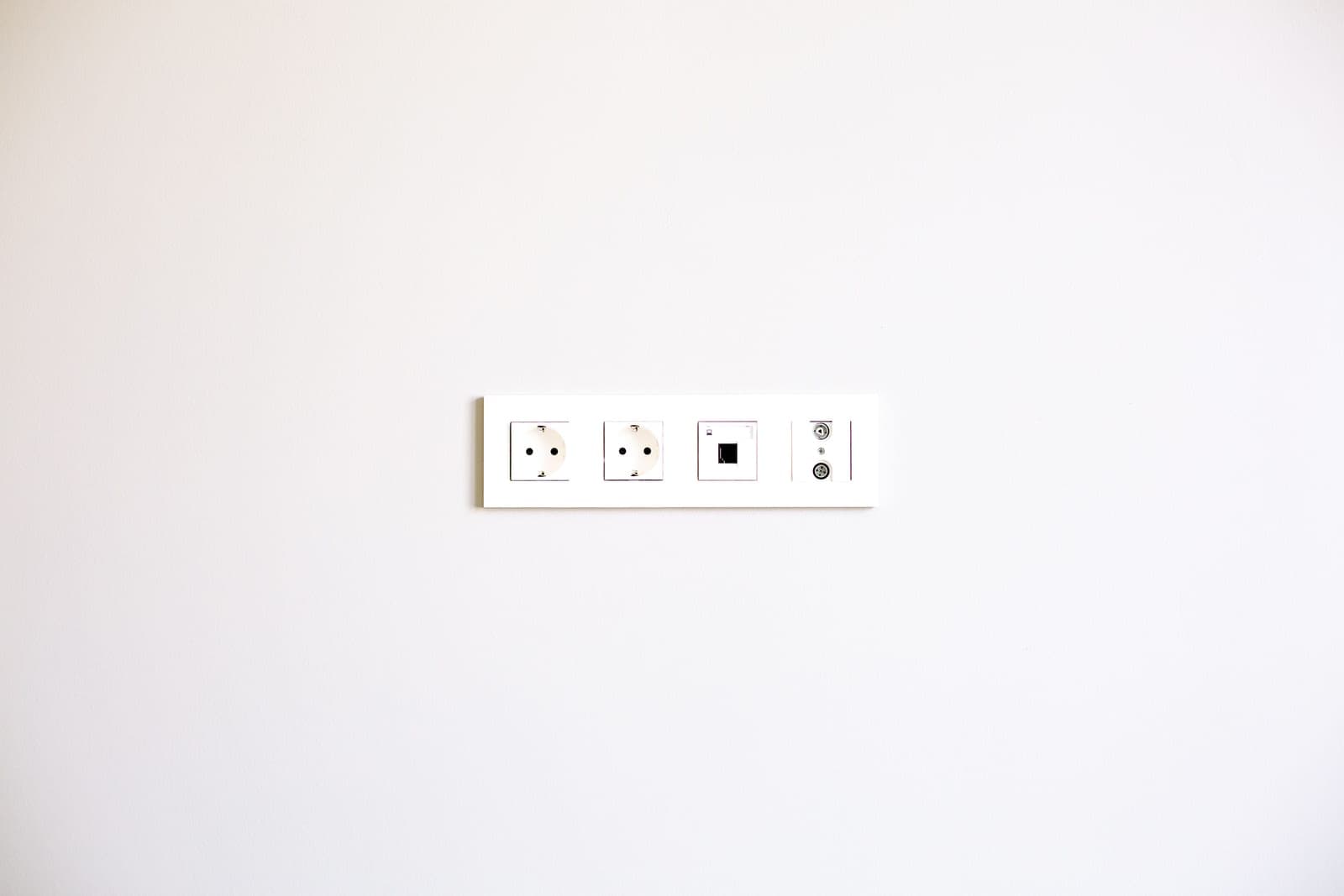 An electrical socket outlet on a wall panel