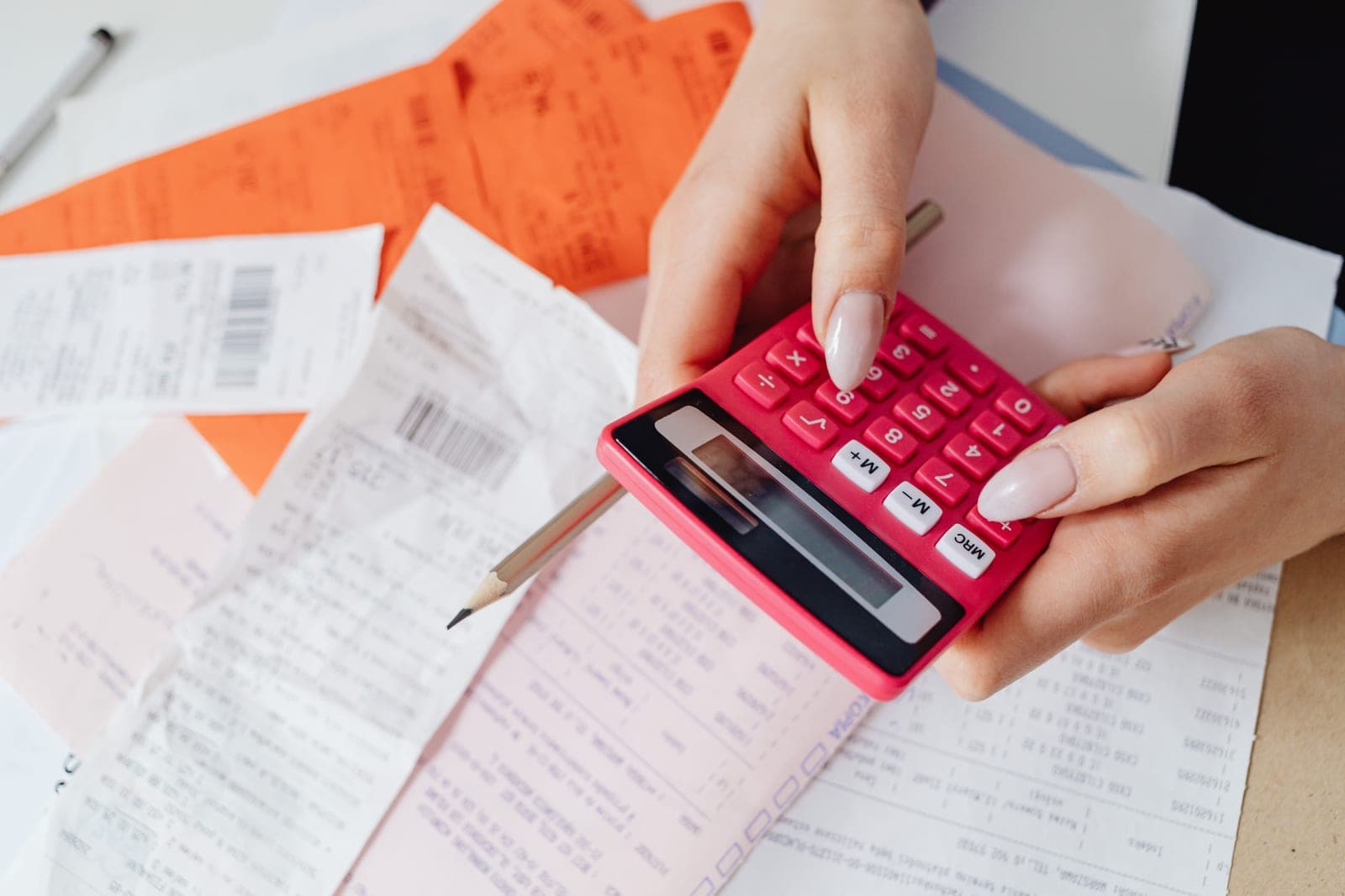 A calculator resting on an electricity bill