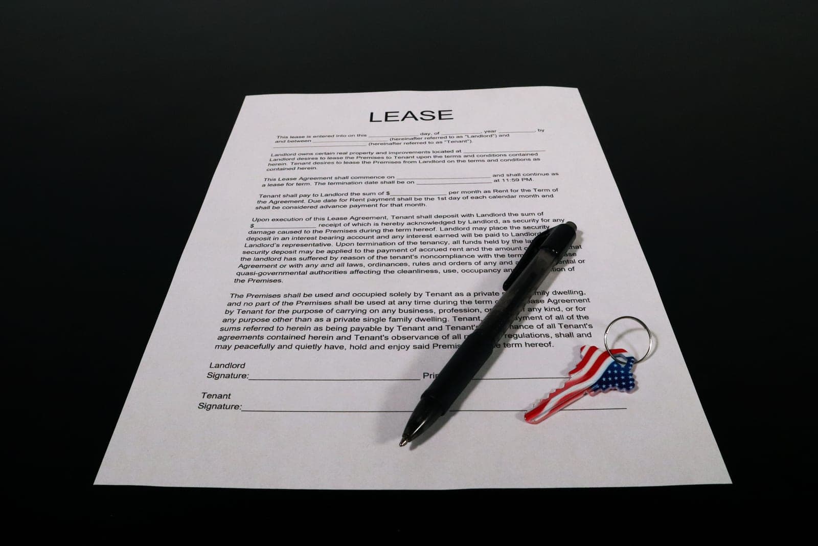 Apartment keys resting on a signed lease document