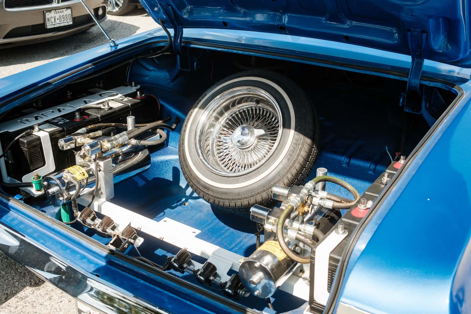 An open car trunk with equipment stored inside